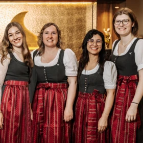 Staff in traditional attire at Klosterhof hotel.